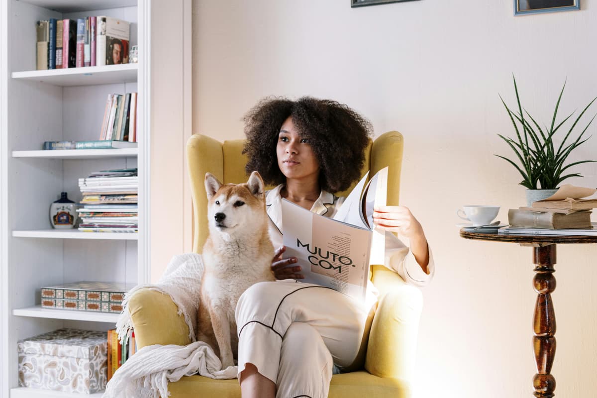 Woman relaxing at home with her dog
